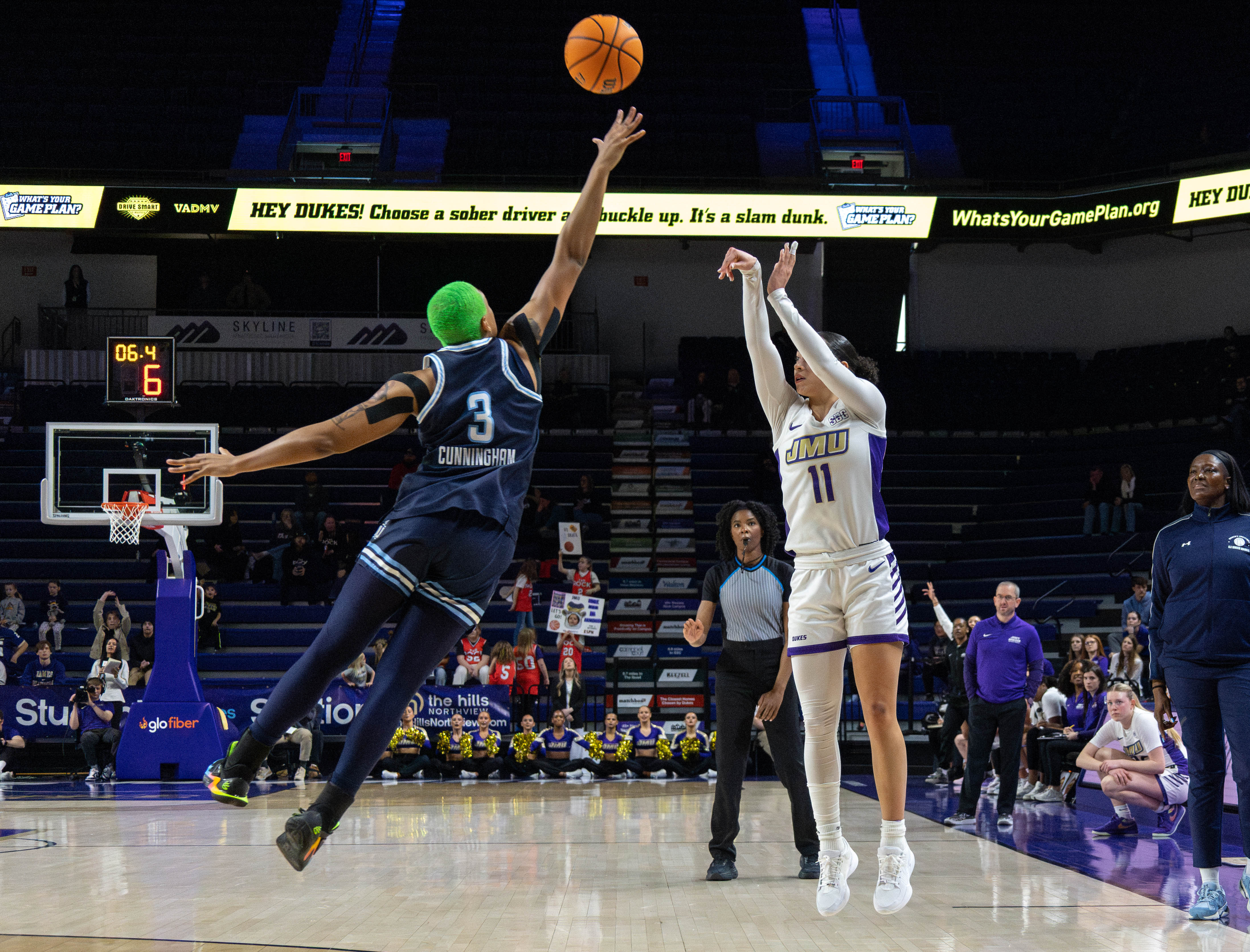 JMU basketball player in game action